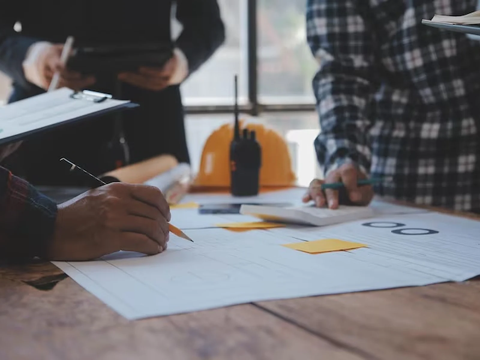 Construction professional reviewing project work on site