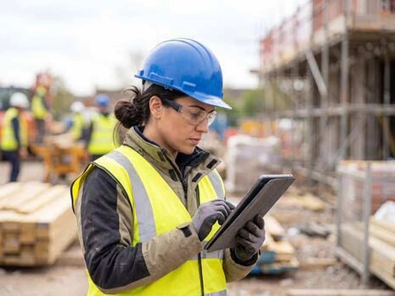 Construction professional reviewing technical work on site